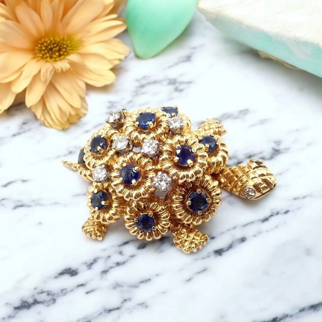 Rare! Authentic Tiffany & Co. Turtle 18k Yellow Gold Diamond Sapphire Pin Brooch: Rare and collectible, this Authentic Tiffany & Co. Turtle Pin Brooch is crafted in lustrous 18k yellow gold. It sparkles with brilliant diamonds and vivid deep blue sapphires, capturing the brand̵