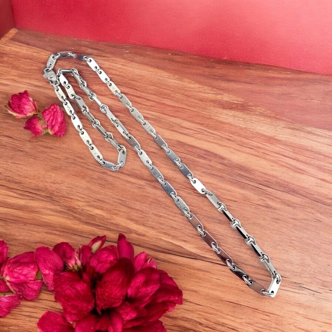 Authentic! Cartier 18k White Gold Flat Link Necklace 17.75" 1998: Exquisitely crafted, this Cartier 18k white gold flat link necklace that was created in 1998 presents a refined aesthetic. Measuring 17.75 inches, the streamlined design exudes effortless sophisticati