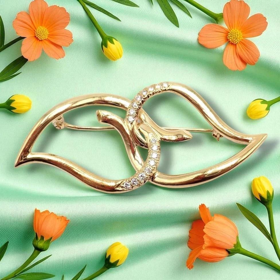 Authentic! Tiffany & Co 18k Yellow Gold Diamond Two Leaf Twin Brooch Pin 1987: Authentic Tiffany & Co. 18k Yellow Gold Diamond Two Leaf Twin Brooch Pin (1987). This elegant vintage piece features a flowing twin-leaf design accented with sparkling round brilliant diamonds. Crafte