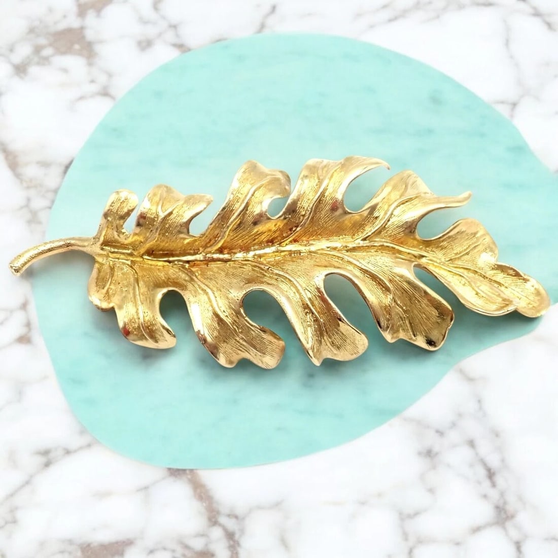 Vintage! Tiffany & Co. 18k Yellow Gold Leaf Pin Brooch: Delicate and timeless, this vintage Tiffany & Co. 18k yellow gold leaf pin was crafted in Italy, showcasing nature-inspired elegance. The gently sculpted leaf shape echoes classic Italian craftsmanshi