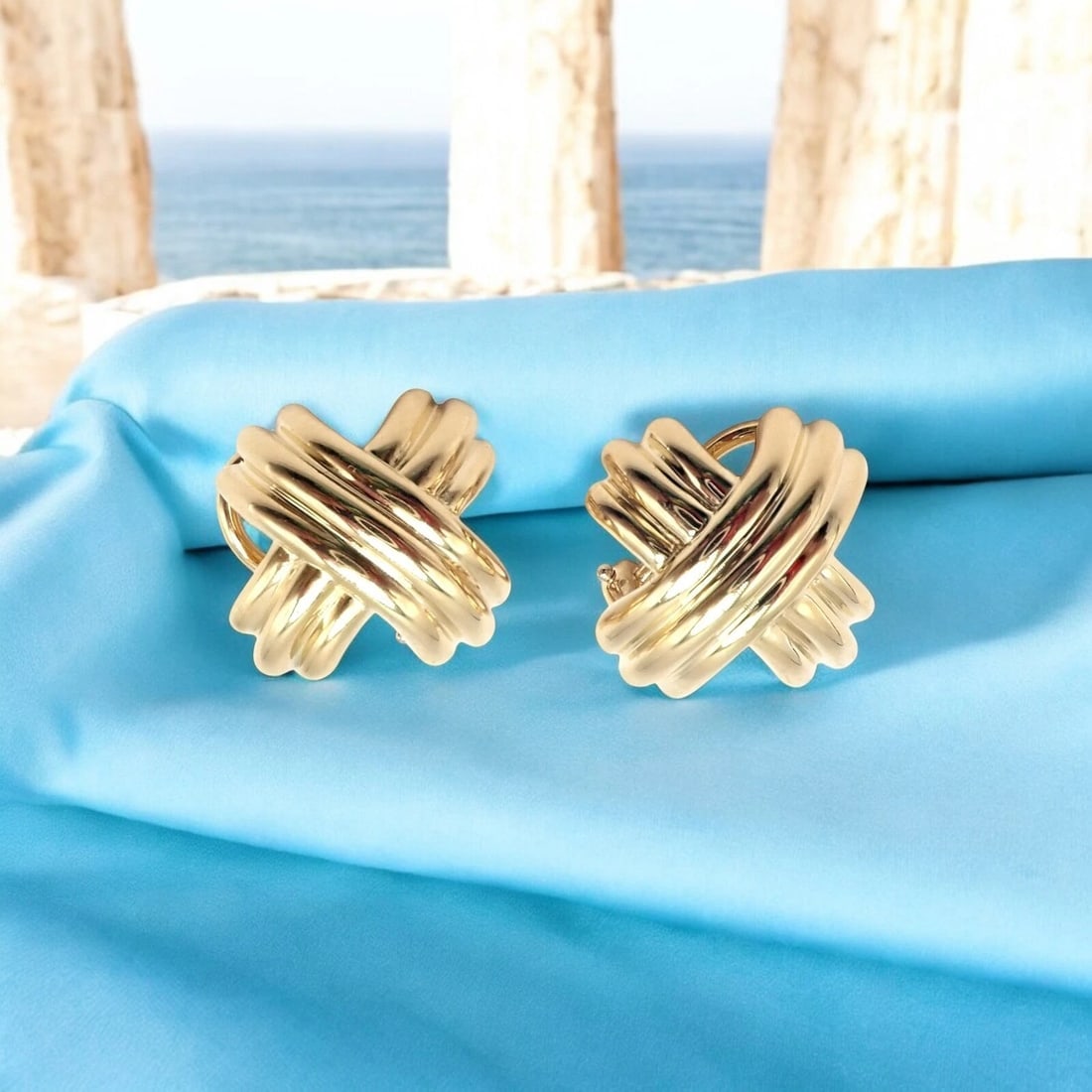 Authentic! Vintage Tiffany & Co X Kiss 18k Yellow Gold Medium Earrings: These vintage Tiffany & Co. X Kiss earrings are elegantly crafted in 18k yellow gold, embodying timeless sophistication. Featuring the iconic "X" design, they symbolize love and elegance with a sleek,