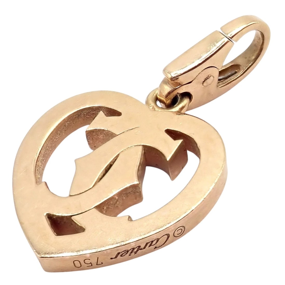 Authentic! Cartier 18k Rose Gold Double C Logo Heart Charm Pendant: Authentic Cartier 18k rose gold Double C Logo Heart Charm pendant, crafted in luxurious 750 gold. The iconic interlocking C motif floats within a sculpted heart, symbolizing timeless love and prestige