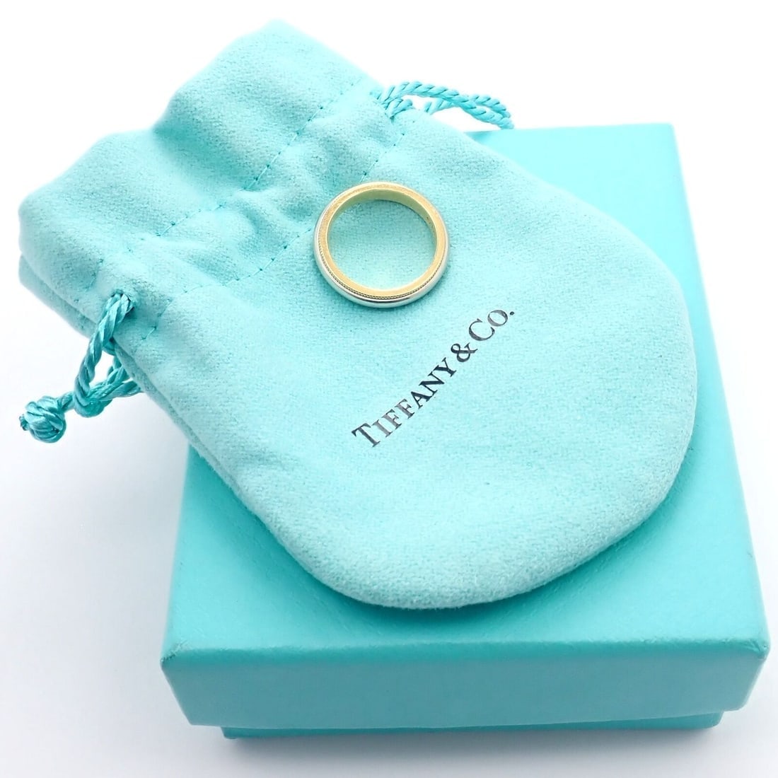 Tiffany & Co. 18k Yellow Gold Platinum 4mm Band Classic Milgrain Ring Sz 5: Tiffany & Co. 18k Yellow Gold Platinum 4mm Band Classic Milgrain Ring Sz 5 Tiffany & Co. 18k Yellow Gold Platinum 4mm Band Classic Milgrain Ring Sz 5 Product Description About This Piece: Metal: 18k Y
