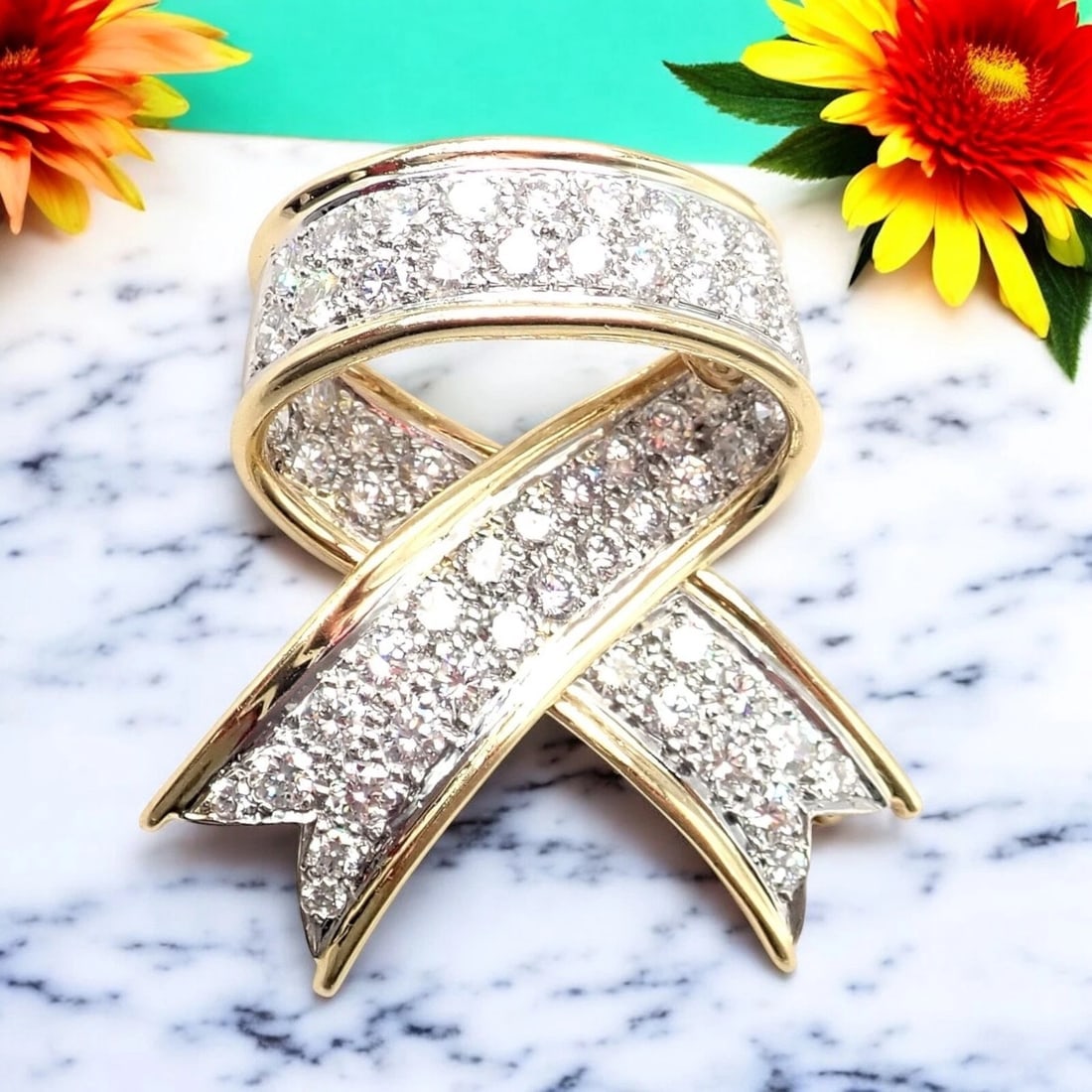 Vintage! Tiffany & Co 18k Yellow Gold Platinum Diamond Ribbon Bow Pin Brooch: A captivating vintage piece, this Tiffany & Co Ribbon Bow Pin exudes timeless elegance in lustrous 18k yellow gold and platinum. The graceful bow shape sparkles with brilliant-cut diamonds, showcasing