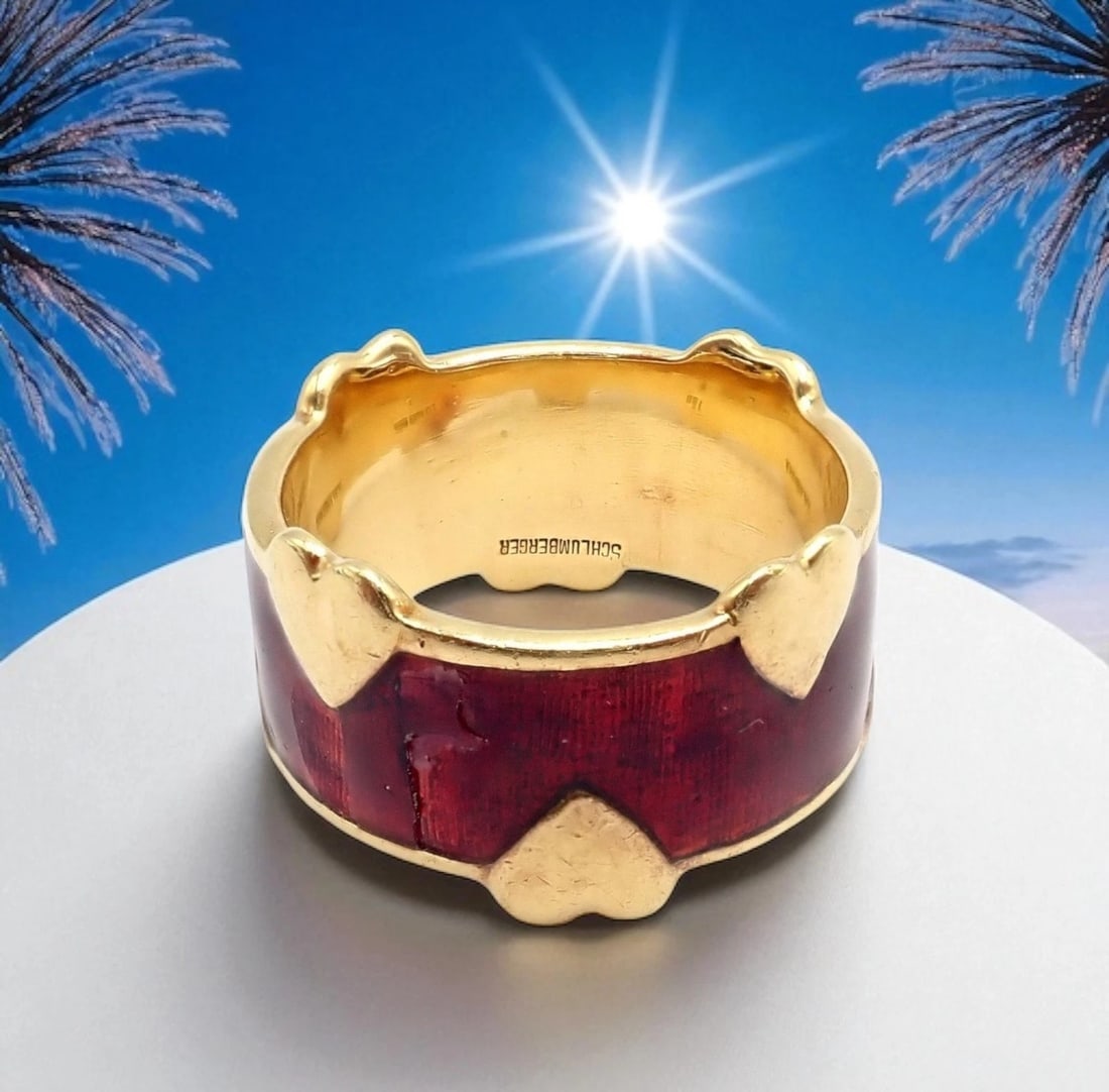 Tiffany & Co Schlumberger 18k Yellow Gold Red Enamel Heart Band Ring sz 6: This Tiffany & Co. Schlumberger band ring is crafted in radiant 18k yellow gold and adorned with rich red enamel. Accented by whimsical gold hearts, the bold design reflects Jean Schlumberger’s 