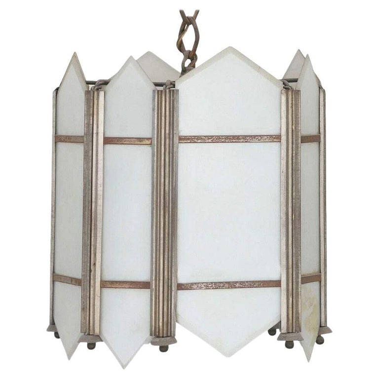 Art Deco Slat Glass Pendant Light: This original early Art Deco ceiling pendant chandelier with a geometric design features white flash opal glass panel inserts fixed to a metal frame. This construction was popular in high-end hotels a