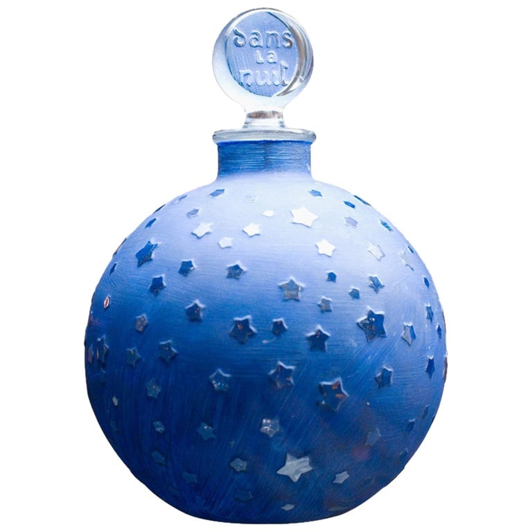 Rare Huge 10.5 inch Lalique "Stars" Dans la Nuit Post-War Factice Perfume Bottle: Designed by the world-renowned Rene Lalique (1860-1945), the Dans La Nuit perfume bottle (also known as the "Stars" bottle) is made of frosted and blue stained glass with a pressed-glass stopper that