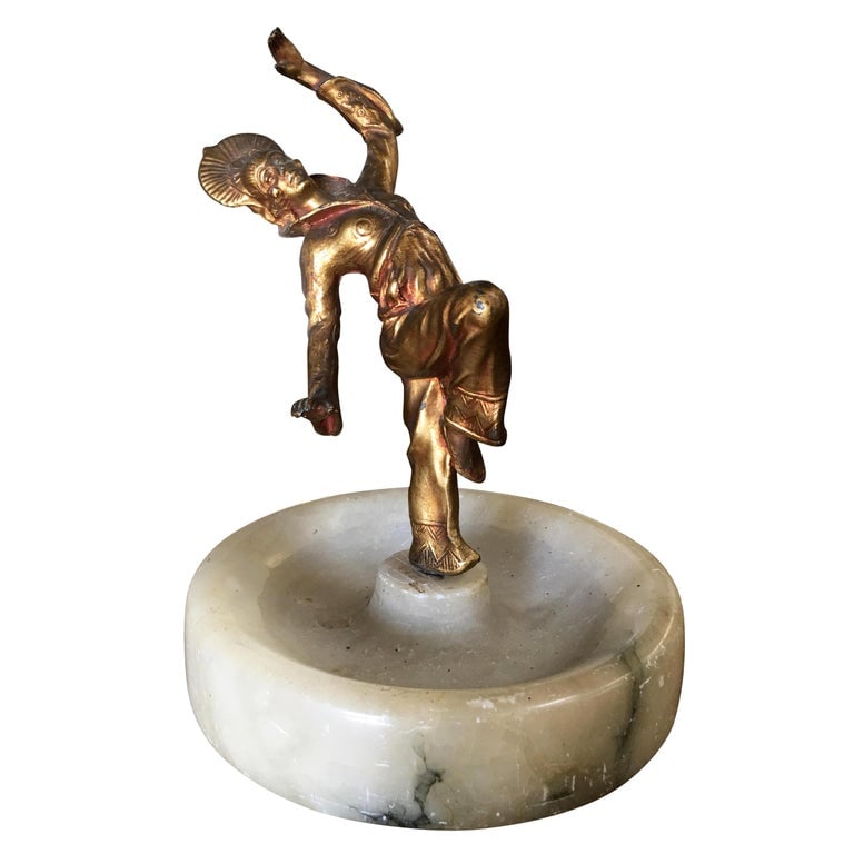 Art Deco Ashtray/Ring Tray with Female Harlequin Dancer Statue by Frankart: Marble ashtray/ring tray with a female Harlequin dancer spelter metal female statue, circa 1920. Reserve: $259.00 Shipping: Domestic: Shipping rates are determined by destination International: