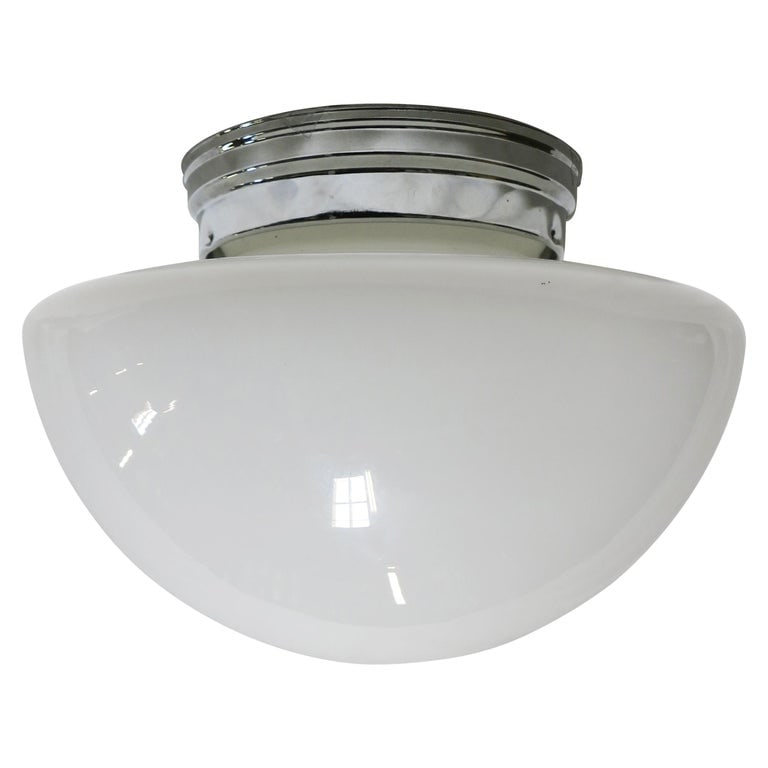 Short Schoolhouse Mushroom-Shape Ceiling Glass Globe Pendant: Once used everywhere from classrooms, libraries and courthouses alike, schoolhouse globes offered a practical and utilitarian design with solid, hard-working ambient lighting. Our globe features a rou