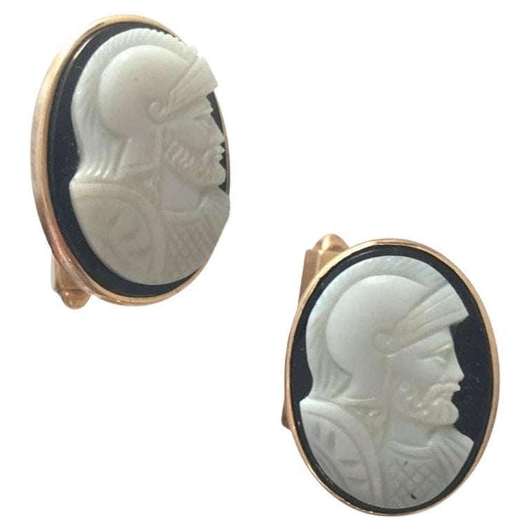 Hand Carved Shell "Knight" Cameo Cufflinks in 14-Karat with Bullet Back Clasp: Vintage 1950s cameo "Knight" cuff links, full marked "14K" featuring a 14-karat post with a hand carved portrait of a knight fixed to a back clasp. The cuff links measure 20mm tall by 14mm wide. Reser