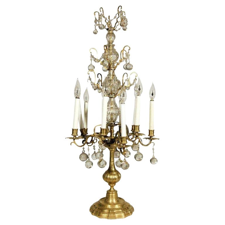 French 19th Century Crystal and Glass Girandole Table Lamp: This 19th-Century French girandole features a hand-etched base, four tiers of brass embellished with crystal accents. The girandole was originally converted to electric around the turn of the 20th cen