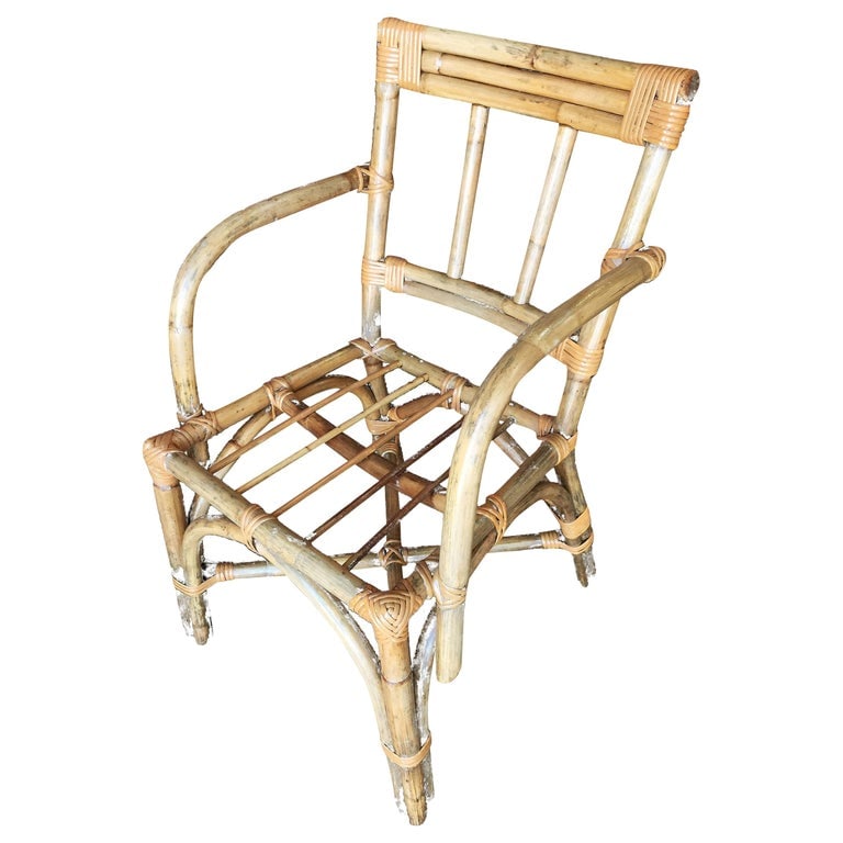 Midcentury Swoop Arm Rattan Armchair with Triple Pole Back: Vintage swoop arm rattan dining room chair pair. the chair features a triple pole back seat back and unique swoop arm design. Cushions made to order included. All cushions are C.O.M. (customers own ma
