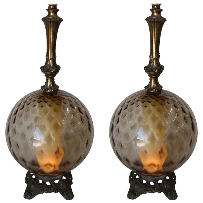 Hollywood Regency Smoked Bubble Glass Table Lamps Inner Glowing Accent Light: Pair of midcentury era Hollywood Regency textured smoked bubble glass table lamps with inner glowing accent light. Measures: 28" high x 12" diameter. Reserve: $1,001.00 Shipping: Domestic: Shipping ra