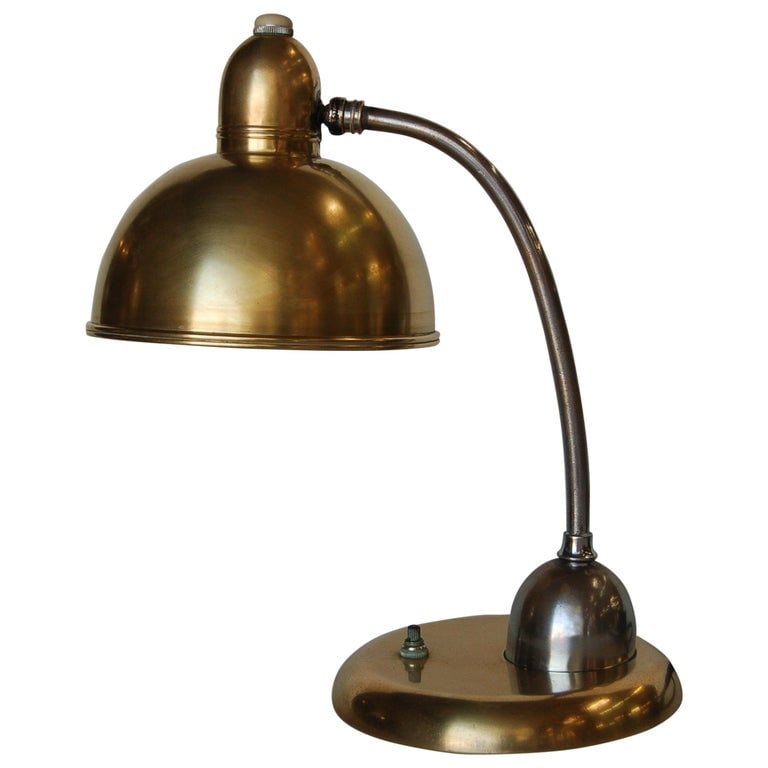 Brass and Chrome Machine Age Bell Shade Reading Desk Lamp: Machine Age brass and chrome bell shaped reading desk lamp. Measures: 13"H x 7" W x 11" D. Reserve: $483.00 Shipping: Domestic: Shipping rates are determined by destination International: Foreign ship