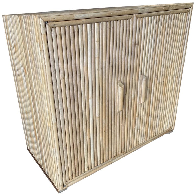 Restored Vertically Stacked Rattan Lowboy Cabinbet: Paul T. Frankl inspired vertically stacked rattan lowboy cabinet with a solid mahogany top. The cabinet features double doors and two adjustable shelves. Restored to new for you. We only purchase and