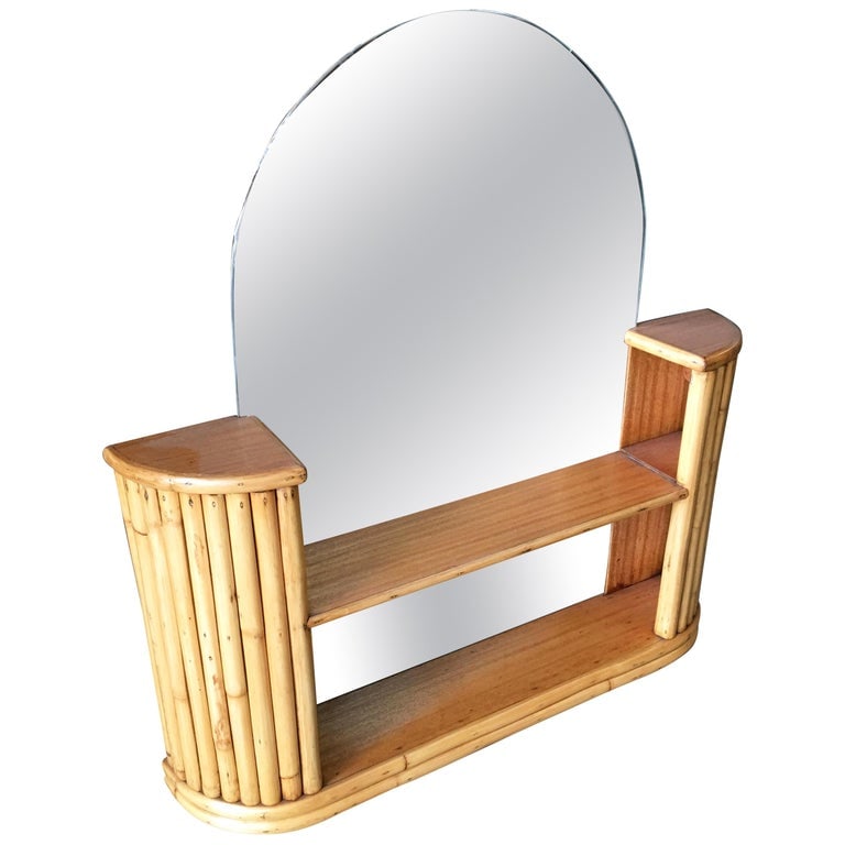 Post War Rattan Vanity Table Console Mirror with Shelf: Post War rattan table top console mirror with built-in two-tier shelving. Perfect for a vanity. Restored to new for you. We only purchase and sell the best and finest rattan furniture made by the best