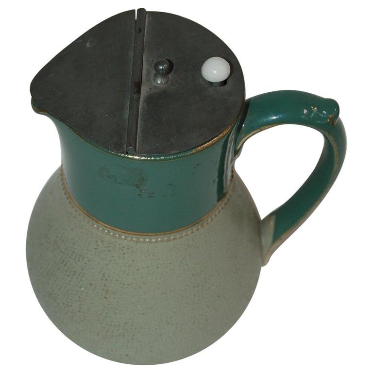 Glazed Ceramic Pottery Green Lidded Pitcher by Lovatts Langley, England: 1930s ceramic aqua green and gold push button pewter lidded pitcher Lovatts Langley ware England leadless glaze. Measures: 6" high x 5" wide 4" deep. Reserve: $121.00 Shipping: Domestic: Shipping rat