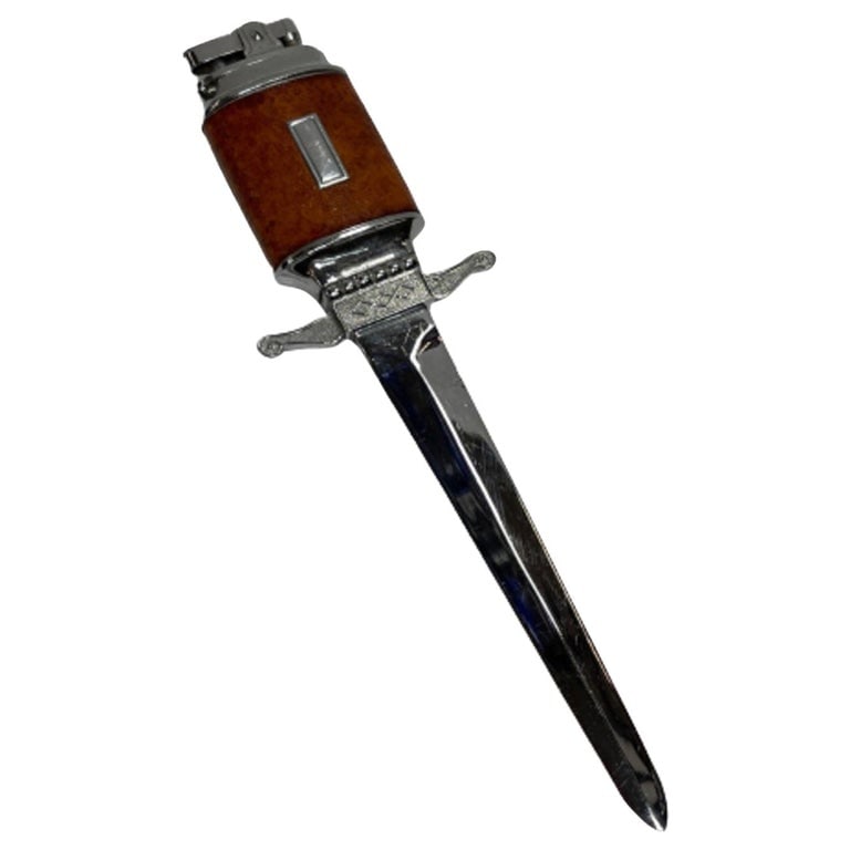 Chrome Midcentury Leather Wrapped Letter Opener Lighter: Original midcentury leather wrapped letter opener lighter with a blank monogram. The lighter comes fully functional with fresh flit and fluid ready for use. Reserve: $183.00 Shipping: Domestic: Shippi