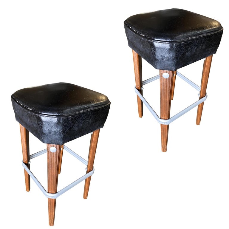 Modernist Steel Studded Knife Leg Bar Stool w/ Black Top Circa 1970, Pair: Pair of original 1970s modernist steel studded knife Leg bar stools. Each bar stool comes with a steel foot rest and black Naugahyde seat covers. Sold as a set of 2. Reserve: $828.00 Shipping: