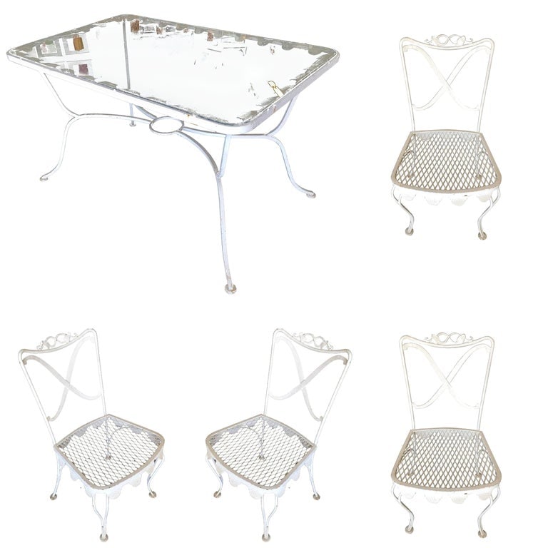 Wrought Iron Scrolling Pattern Cafe Patio Set Table w/ 4 Chairs: Woodard wrought iron scrolling pattern patio/outdoor set featuring four side chairs, two armchairs, and one glass-top dining table. The set is fashioned after the outdoor seating sets made popular on