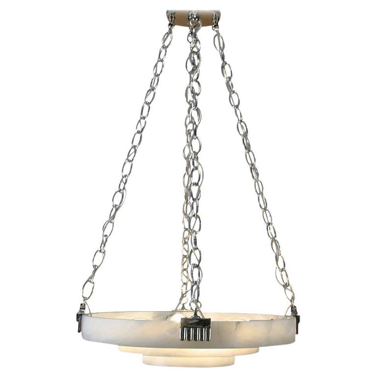 Ruhlmann Style Three-Tier Alabaster Stepped Deco Pendants: Large 24" diameter Art Deco style ceiling pendants shows many of the design characteristics made famous by E´mile-Jacques Ruhlmann. The piece features a large stepped circular alabaster shade with br