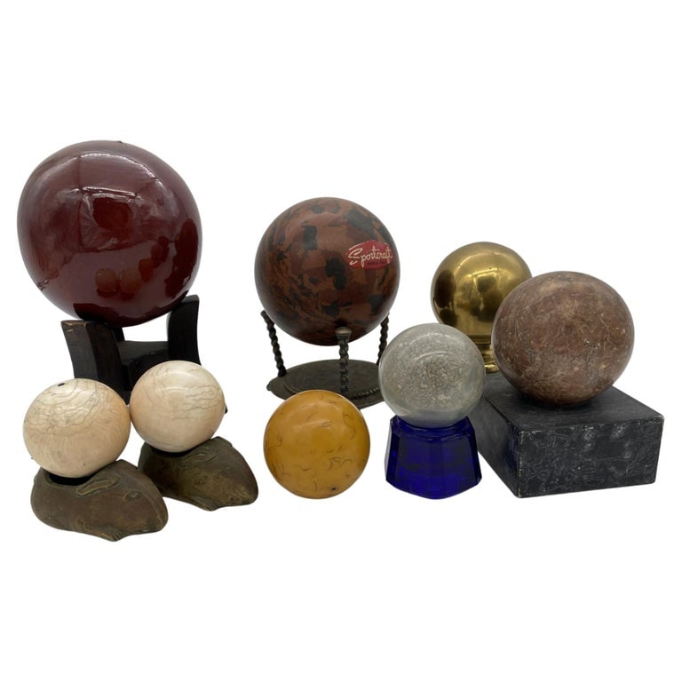 Vintage Marble, Brass, Resin, Glass Spheres with Stands Collection: Collection of 8 Spheres featuring 4 in marble and stone, 2 resin, 1 Ceramic and one in brass. Seven come with bases. The largest is 8" Tall with the smallest being 3" Tall. Reserve: $828.00 Shipping:
