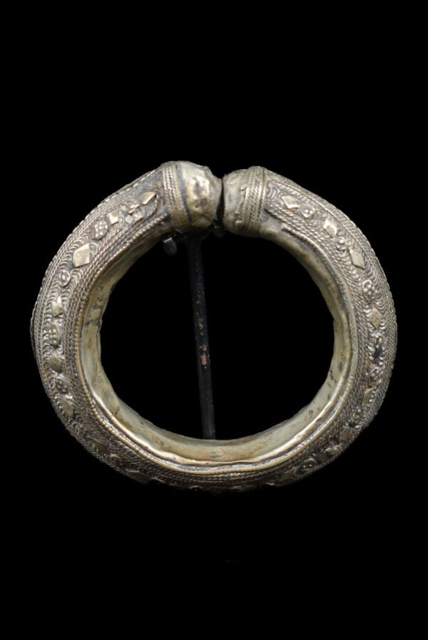 Bracelet - Silver - Yemen: An unique Rashaida bracelet from Yemen, crafted in metal, silver colored with intricate geometric and beaded designs. This bold tribal bangle was traditionally worn as both ornament and wealth, with