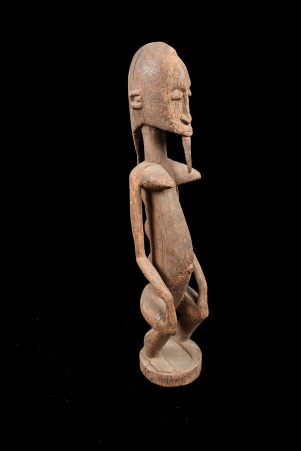Ancestor figure - Wood - Dogon - Mali: Powerful Dogon ancestor figure from Mali. Stylish wooden male ancestor figure from the DOGON tribe, Mali. Good condition with beautiful aged patina. Dogon figures are predominantly associated with the