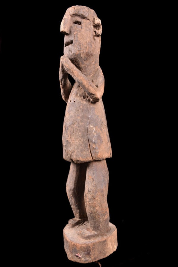 Ancestor Figure - Wood - Nepal: Wooden ancestor figure from Nepal on custom made stand. Great standing wooden ancestor figure from Nepal. Wood, covered with pigment, standing with a raised arm. Ancestor figures were placed on family