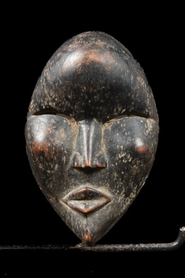 Mask - Wood - Dan - Ivory Coast: Lovely Dan mask in a very expressive design. The Dan style is quite evident, with slith eyes and large bulging mouth Good condition with a beautiful aged patina on the wood. The border between Cote