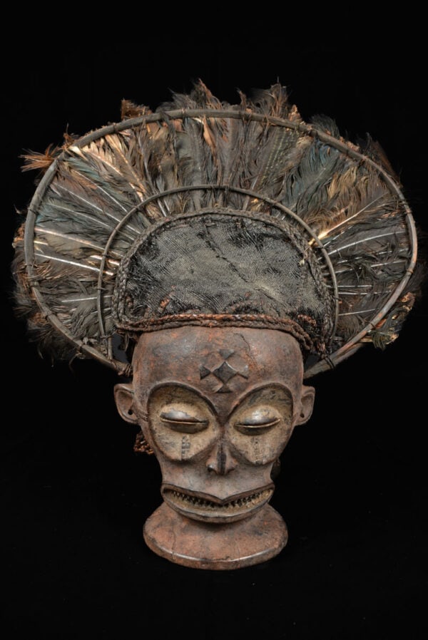 Chihongo Mask - Feathers, Wood - Chokwe - DR Congo: Beautifull stylistic Chihongo mask with age from the CHOKWE tribe, Angola. The most popular and best-known entertainment masks are Chihongo, spirit of wealth, and pwo, his consort. Gaunt features,