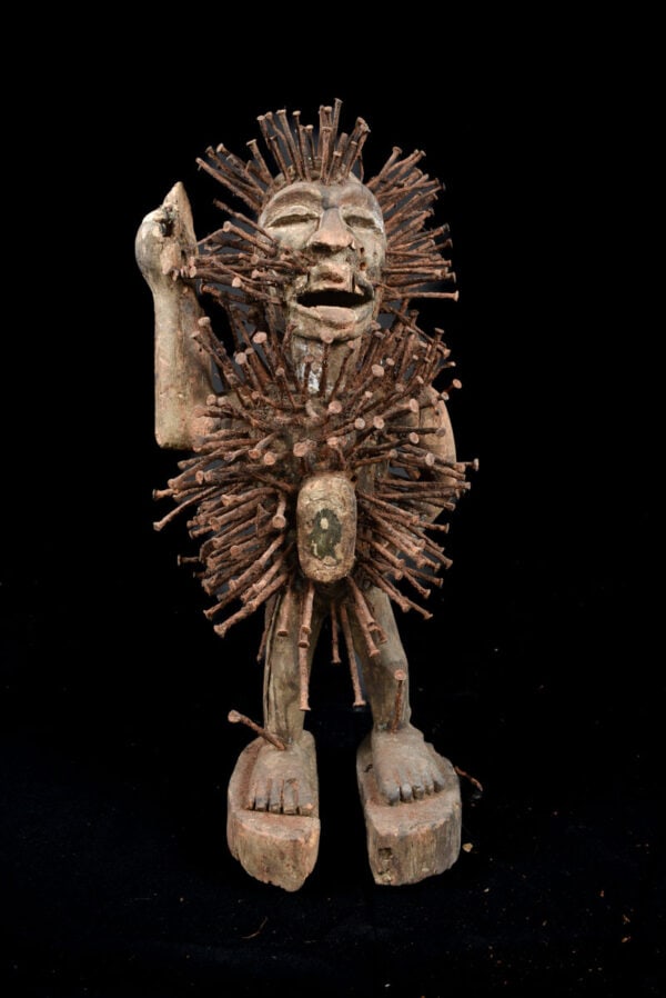 Nkisi Figure - Wood, Nails - Yombe - Congo: Very complete Nkisi fetish figure from the Yombe tribe of DR Congo. A Nkisi refers to the spiritual nature of the figure where nkondi refers to the power of the figure itself. Spiritual and religious