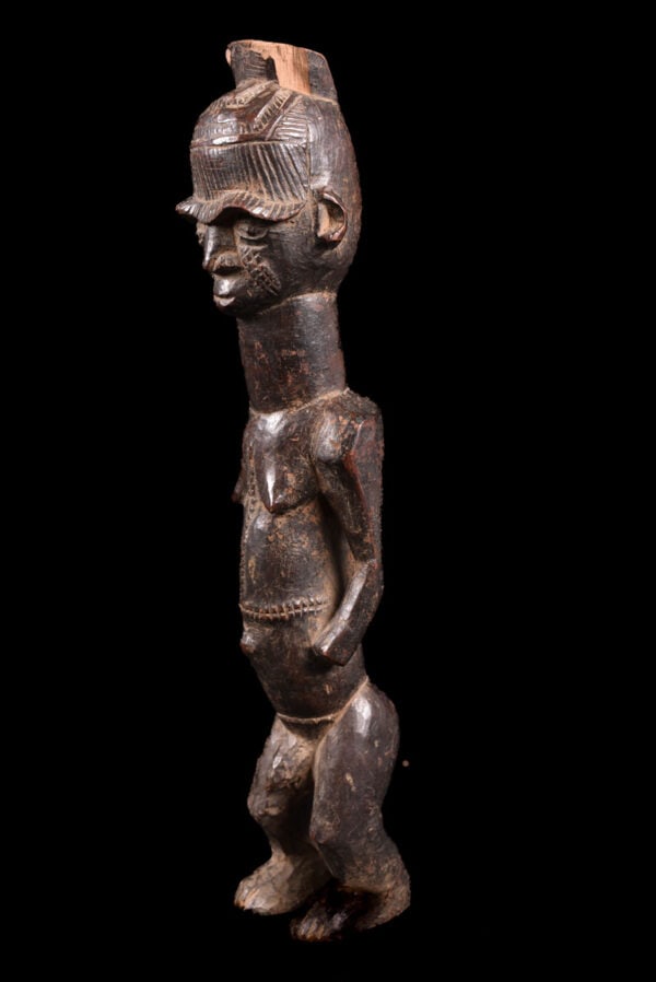 Shrine Figure- Wood - Igbo - Nigeria: Standing wooden figure from the Igbo people of Nigeria. The 8,000.000 IGBO people - who live primarily from farming - settled in the northern part of the Niger River Delta, in an area of forests and