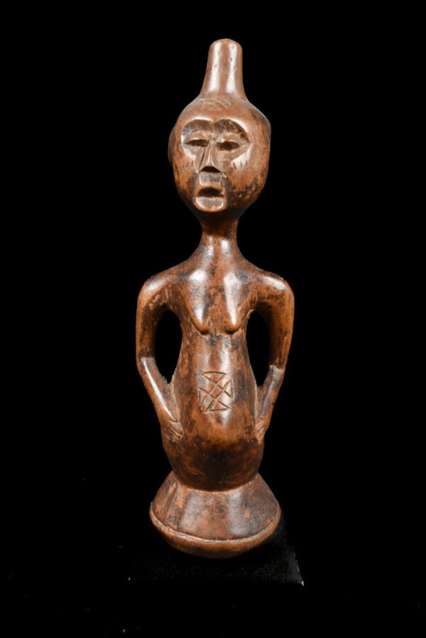 Ancestor figure - Wood - Luba - DR Congo: Stylistic wooden male ancestor figure from the Luba people of DR Congo. The figure has a fine face expression. This serene Luba figure epitomizes the art and mystery that carvers from this tribe have