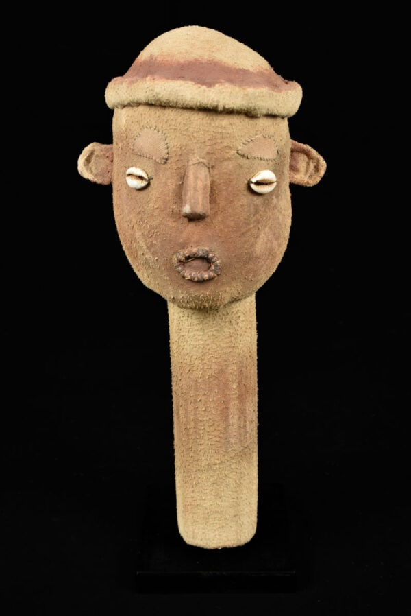 Muzidi / Niombo Head - Bwende - DR Congo: This childlike puppet-like head forms a reduction of the famous niombo, a funerary anthropomorphic "package`, sometimes giant size, representing deceased among the Bwende. The niombo was buried at