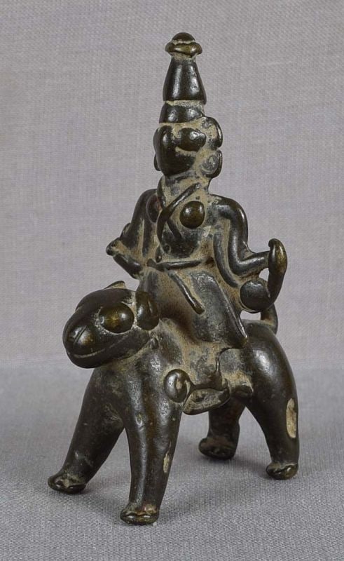 18c Indian bronze GODDESS DURGA riding LION: 18th century small votive Indian bronze sculpture depicting the mother goddess Durga riding a lion - her vehicle. Durga is the most powerful female deity in the Hindu pantheon. Great bronze with