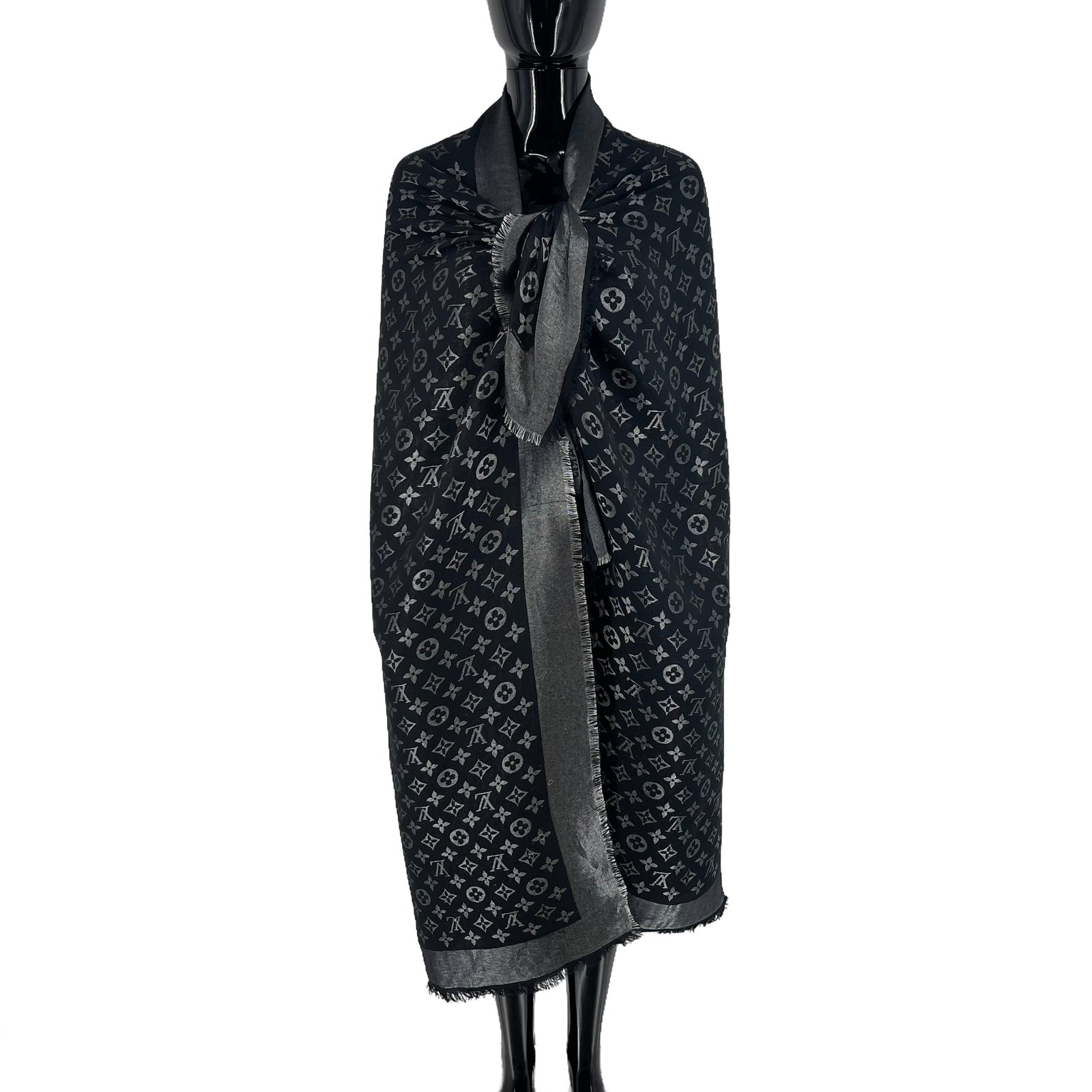 Louis Vuitton Black Reversible Silk Wool Scarf: Title: Louis Vuitton Black Reversible Silk Wool Scarf Brand:Louis Vuitton Date/Period:Modern Materials:50% Silk 30% Metal 20% Wool Size:One Size Description:Louis Vuitton Black Reversible Silk Wool Sc