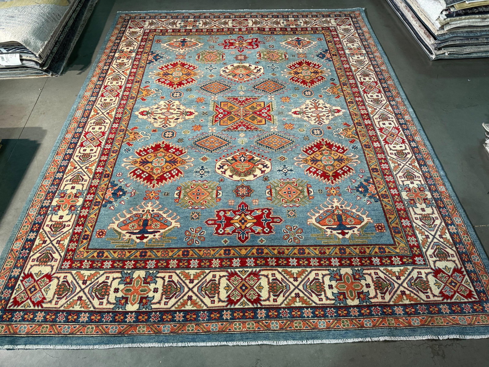 Exquisite Fine Kazak Rug 8.1x10.1: Title:Exquisite Fine Kazak Rug 8.1x10.1 Description:8'.1 x10'.1" Fine Kazak Rug, hand spun and hand knotted rug in Pakistan 100% Vegge Dye natural wool with beautiful High Sheen Pile , in Royal Blue, 