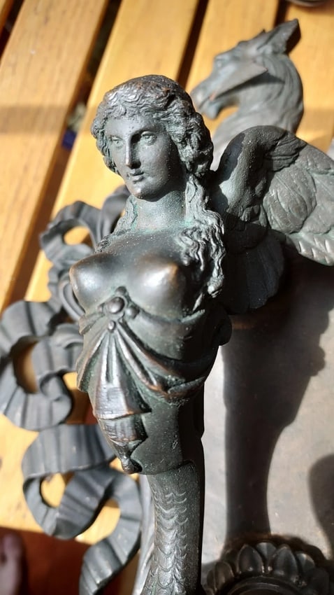 Fantastic Cast bronze door Knocker best I have seen: Fantastic looking piece in excellent condition. Have never seen anything like this. It attaches by drilling holes in doors. Most I have seen leave nuts exposed on interior. This has decorative nut