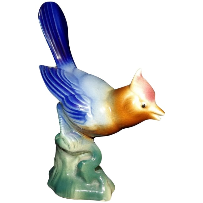 Royal Copley Bird Figurine: This Royal Copley Bird Figurine is in excellent condition. NO chips, flea bites, loss of color etc. Stands 8" tall x 5 3/4" length and 2 3/4" in width. Most likely from the 50's. Shipping: Domestic: