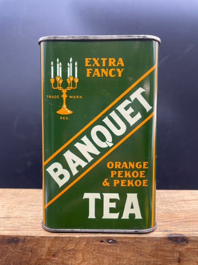 1930's Banquet Tea Tin Extra Fancy: Date/Period: Approx. 1930's Dimension: Approx. 5" x 3.25" x 3.25" Material: metal Additional Information: 1930's Banquet Tea Tin Extra Fancy Orange Pekoe & Pekoe Shipping: Domestic: Flat-rate of