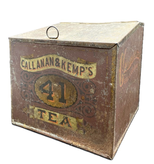 Callanan & Kemp Tea Bin General Store Advertising: Date/Period: unknown Dimension: Approx. 8 x 8 x 8 Material: metal Additional Information: The Callanan & Kemp Tea Bin General Store Advertising is a vintage blue tin container that serves as a