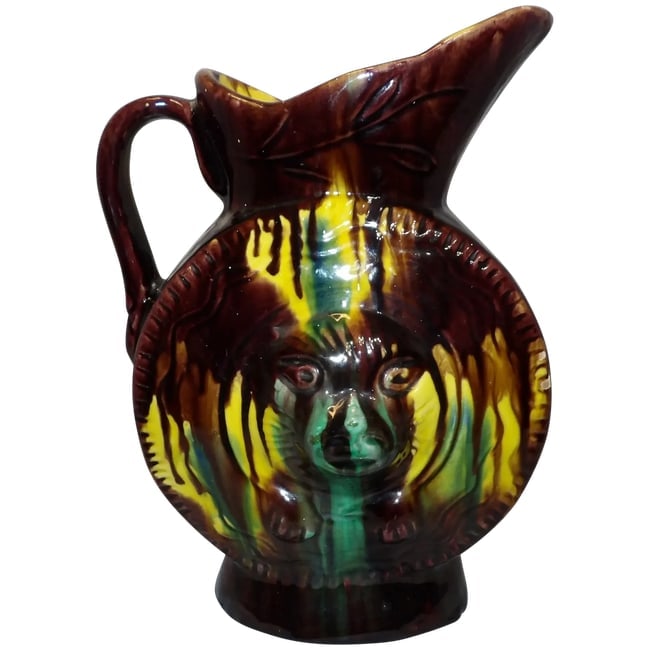 Antique Majolica Drip Ware Bear Pitcher: This Antique Majolica Drip Ware Bear Pitcher is in excellent condition. Had 3 minor glaze missing spots at the bottom (has been corrected) but no other problems such as cracks, crazing, or chips. It
