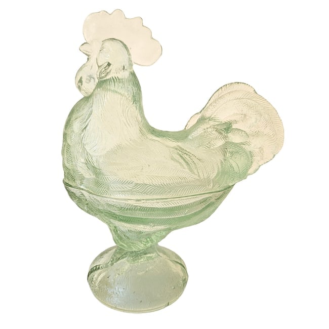 Vintage Pale Green Clear Glass Hen on Nest, Rooster Candy Dish: Glass rooster is a two-piece candy or trinket dish. It features a lidded design shaped like a standing rooster with detailed feather patterns. Measures approx. 9" Tall x 7.5" Long Weighs 2 lbs.