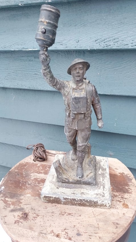 Figural Lamp Doughboy WWI 1920 Metal Lamp Base: Great looking piece in good condition physically . Well done. Gun is missing. I usually see hand replaced this one is intact. E M Viguernsey sculpture Americus Georgia. Dates to 1920. 14" . Shipping: