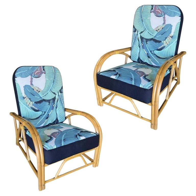 Restored "40s Transition" 2-Strand Adjustable Back Rattan Lounge Chair, Pair: Pair of Two-strand "1940s Transition" rattan lounge chairs. The chairs feature an arm style that flows simultaneously into the rounded back of the chair with a decorative 2 pole design accented with s