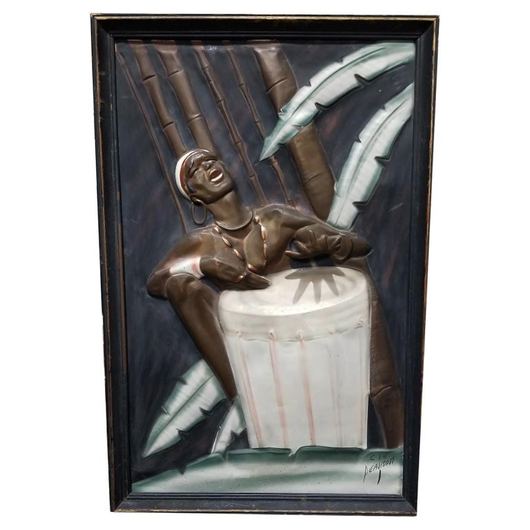 Mid Century Cooper Embossed Bongo Player Wood Framed by C.I.E. Pearson: Vintage Cooper Embossed artwork Bongo Player signed C.I.E. Pearson in black Wood Framed. This vintage copper embossed piece of art depicts a bongo player against a dark background with palm leaves and
