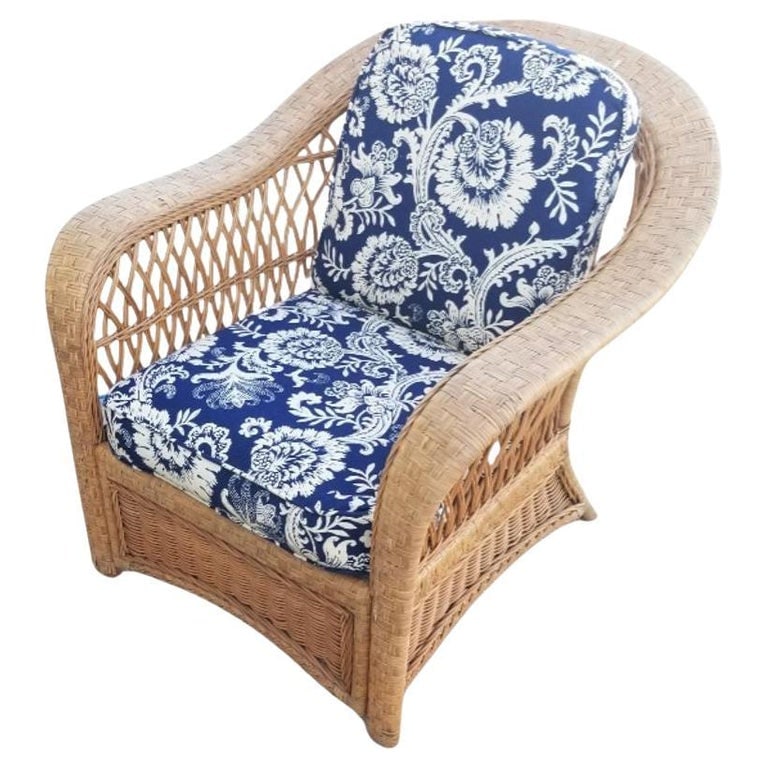Restored Mid-century Rattan and Wicker Cobra Back Lounge Chair: This beautifully restored rattan wicker lounge chair is a stunning piece of furniture with intricate lattice woven sides. It's timeless design exudes vintage charm and comfort, making it an ideal addi