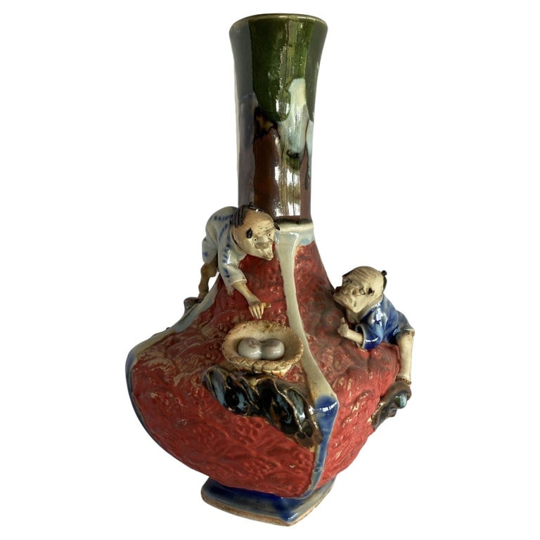 Japanese Sumida Ware Vase with Two Men on Rocky Ledge by Inoue Ryosai II: Sumida¬†ware vase with two men on rocky ledge seeking bird eggs by Inoue Ryosai in the mid-Meiji Period and continued on by two generation potters by the same name until the Showa Period