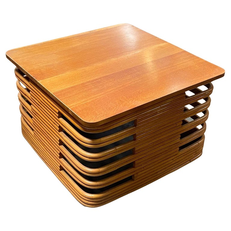 Restored Tall Stacked Rattan Coffee Table with Mahogany Top: Vintage large 18.5" 1940s Rattan coffee/cocktail table with a round square stacked base, stylized cutout sides, and a beautiful mahogany top. Restored to new for you. We only purchase and sell the bes